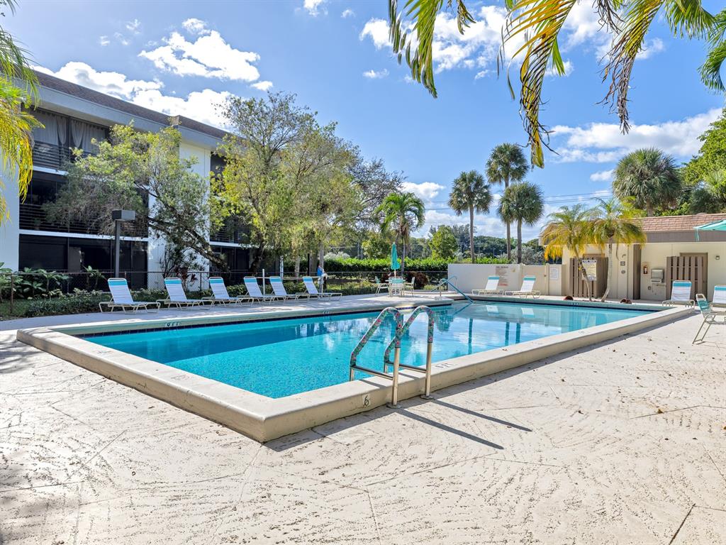7579 Northwest 79th Avenue, Unit 204 Tamarac, FL 33321 - Photo 39 of 45 a view of outdoor space and swimming pool