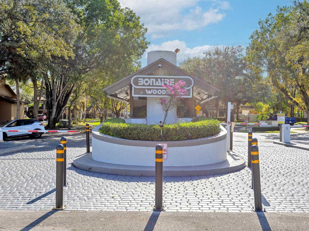 7579 Northwest 79th Avenue, Unit 204 Tamarac, FL 33321 - Photo 42 of 45 a view of a street with a building in the background