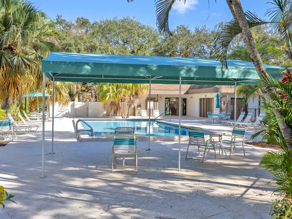 7579 Northwest 79th Avenue, Unit 204 Tamarac, FL 33321 - Photo 43 of 45 a view of a chairs and table in patio