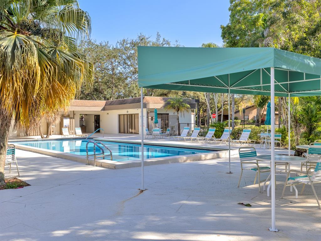 7579 Northwest 79th Avenue, Unit 204 Tamarac, FL 33321 - Photo 44 of 45 a view of house with outdoor space and porch