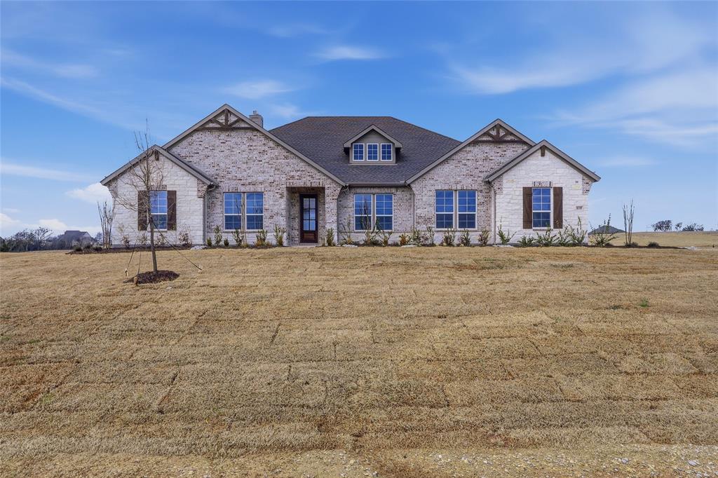 810 Vly Rdg Road Van Alstyne, TX 75495 - Photo 3 of 39 View of front facade featuring a front yard, a chimney, and brick siding