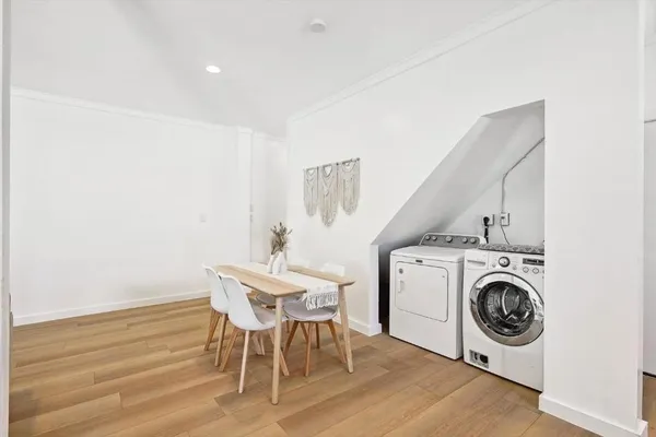 a view of a kitchen with a stove top oven and cabinets