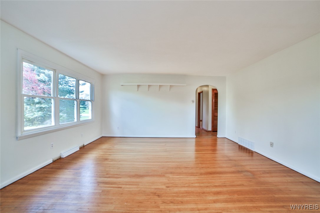 13676 Bloomingdale Road Newstead, NY 14001 - Photo 11 of 39 Nice, bright living room. The hardwood floors ext