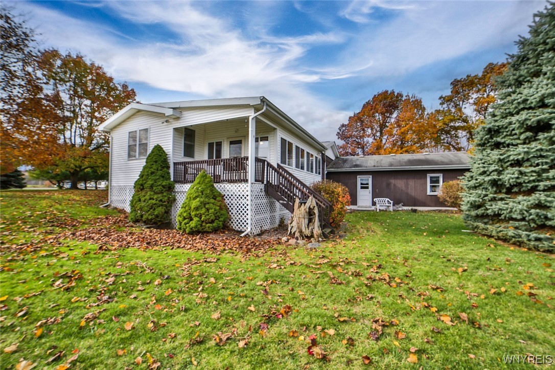 13676 Bloomingdale Road Newstead, NY 14001 - Photo 6 of 39 Charming side covered porch off of the 3 season su