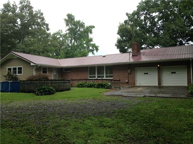 4618 Marion Road Cunningham, TN 37052 - Photo 12 of 16 Back view of the house showing two car garage and pool.
