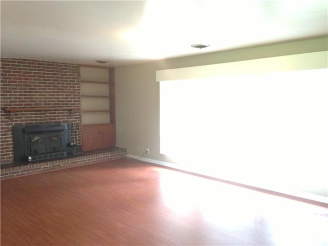 4618 Marion Road Cunningham, TN 37052 - Photo 3 of 16 Large living room with hardwood, fireplace and large window.