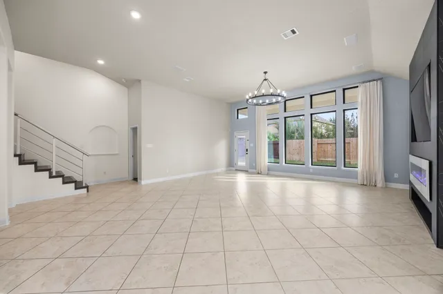 a spacious bathroom with a granite countertop tub sink and mirror