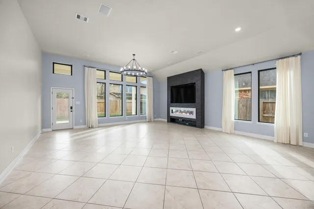 a bathroom with a granite countertop sink and a shower