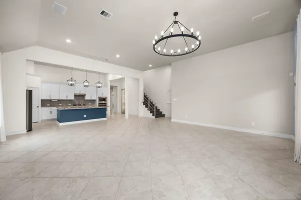 a view of kitchen and kitchen with stainless steel appliances