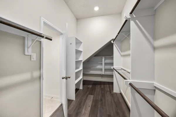 a view of entryway with wooden floor and stairs