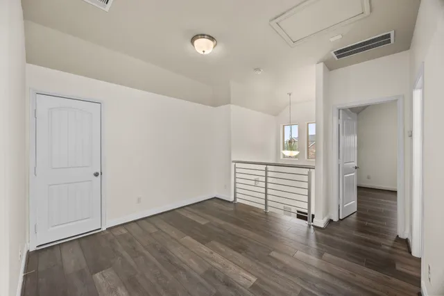 a view of a storage & utility room with dryer and washer