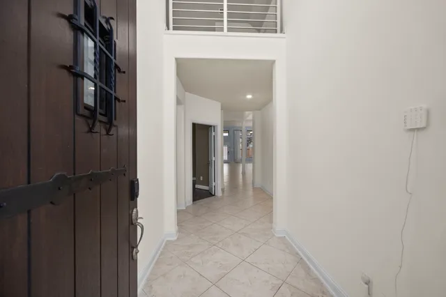a kitchen with a center island appliances and cabinets