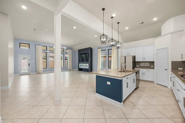a view of kitchen with furniture and a flat screen tv