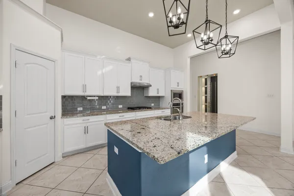a kitchen with a counter space cabinets and stainless steel appliances