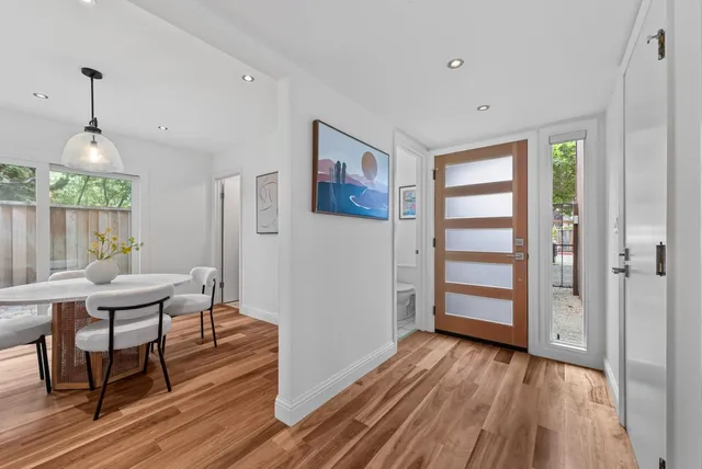 a view of a livingroom with furniture and wooden floor