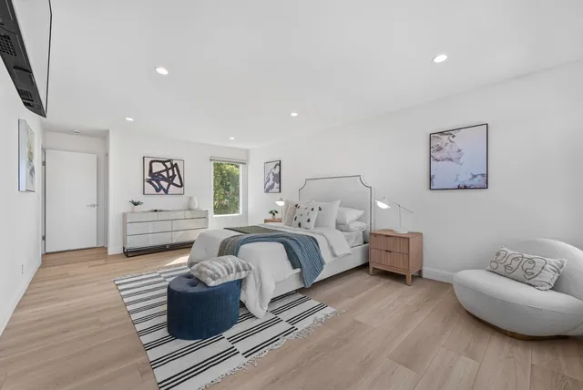 a bedroom with furniture and a couch