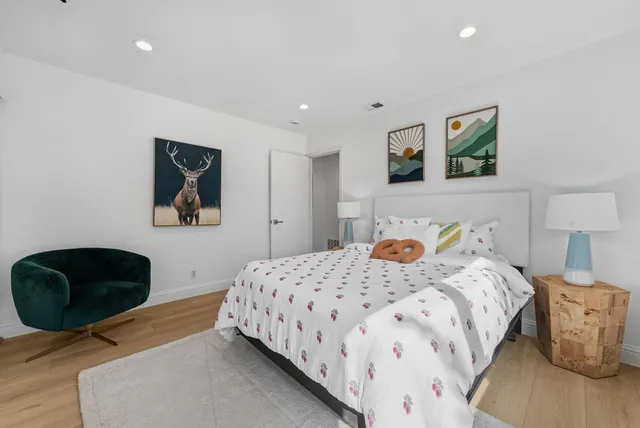 a bedroom with a bed and a couch