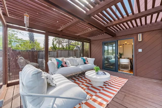 a front view of a house a garden and patio