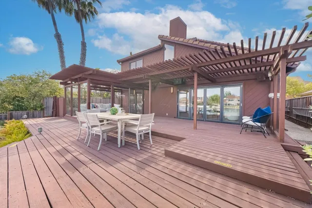 a lake view with a large pool table and chairs