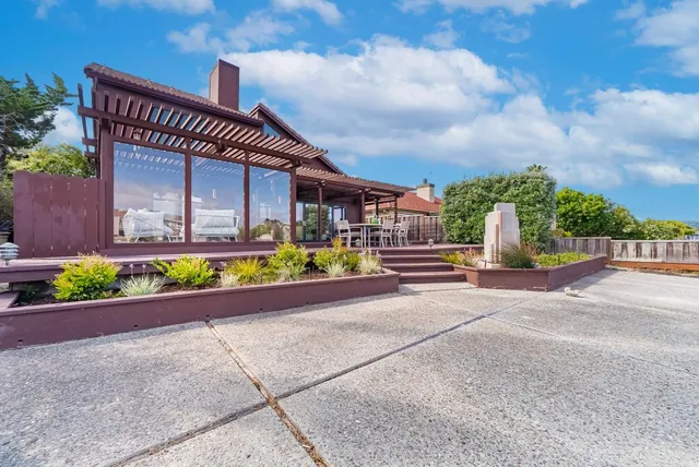 a view of wooden door and a tree