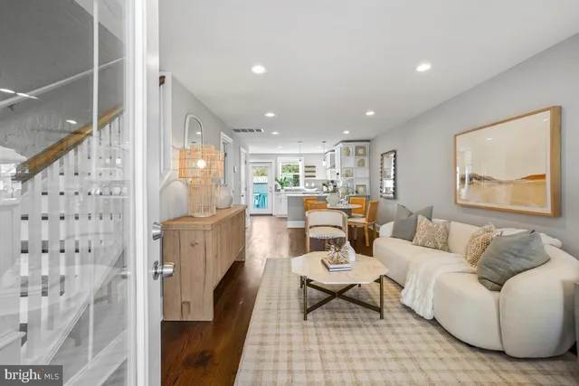 a living room with furniture and a rug