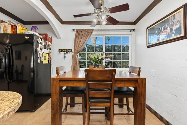 a dining room with furniture and window