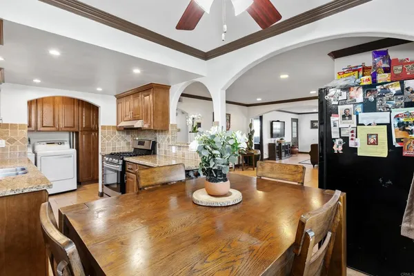 a kitchen with a sink appliances and cabinets