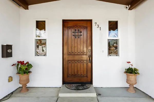 a view of front door with wooden floor