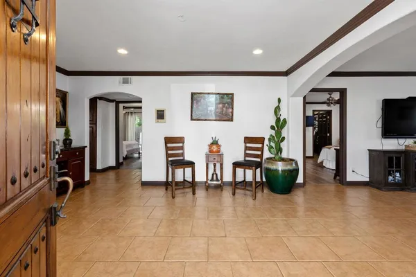 a view of a livingroom with furniture and a flat screen tv