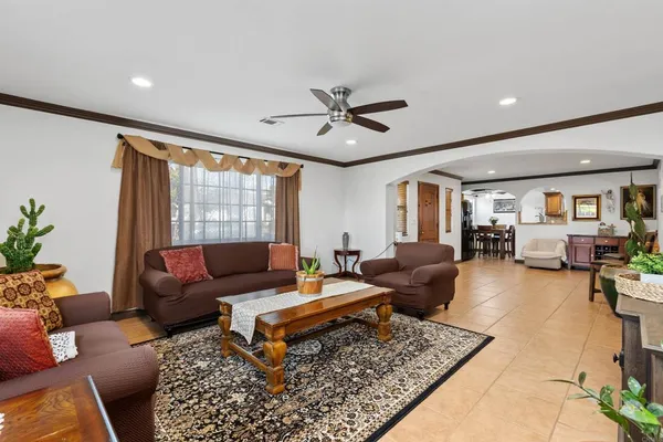 a living room with furniture and a rug
