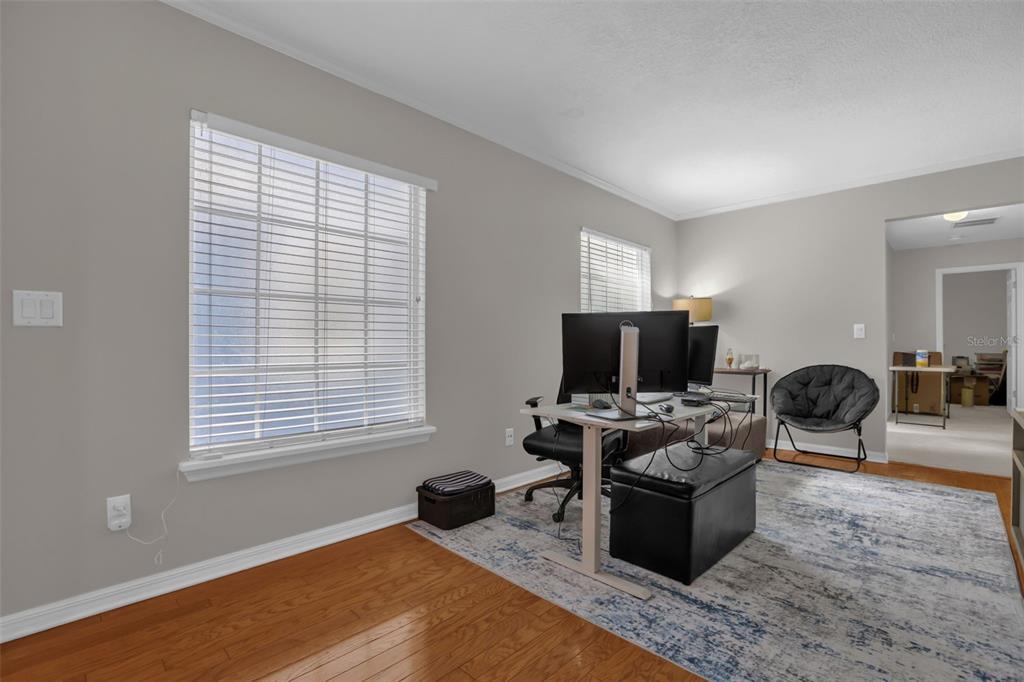 2165 Ridgewood Street Orlando, FL 32803 - Photo 13 of 37 a living room with furniture and a flat screen tv