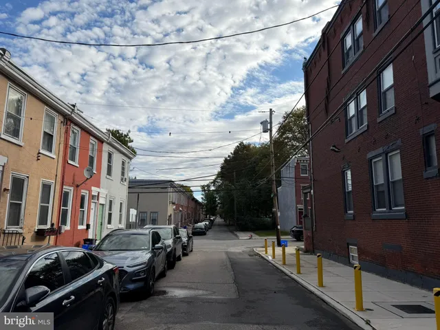 a view of a street with cars