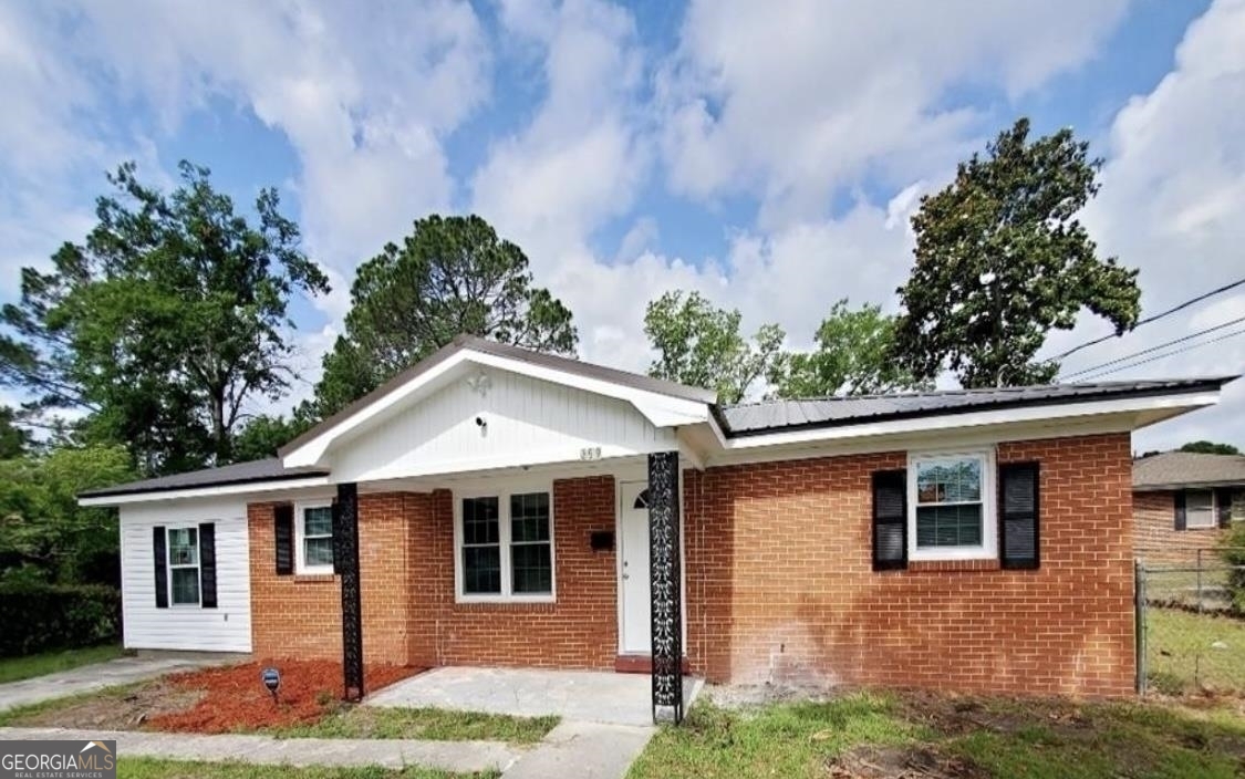 359 Brobston Street Baxley, GA 31513 - Photo 1 of 1 a front view of a house with garden