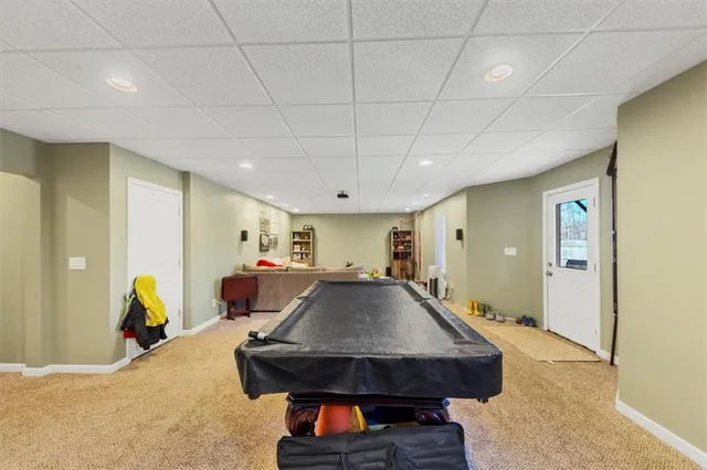 a room with furniture and air hockey table