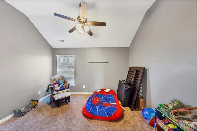 a bedroom with bed and a window