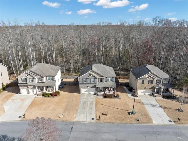 an aerial view of a house with sitting space and garden view