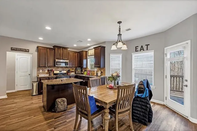 a view of a dining room with furniture window and wooden floor