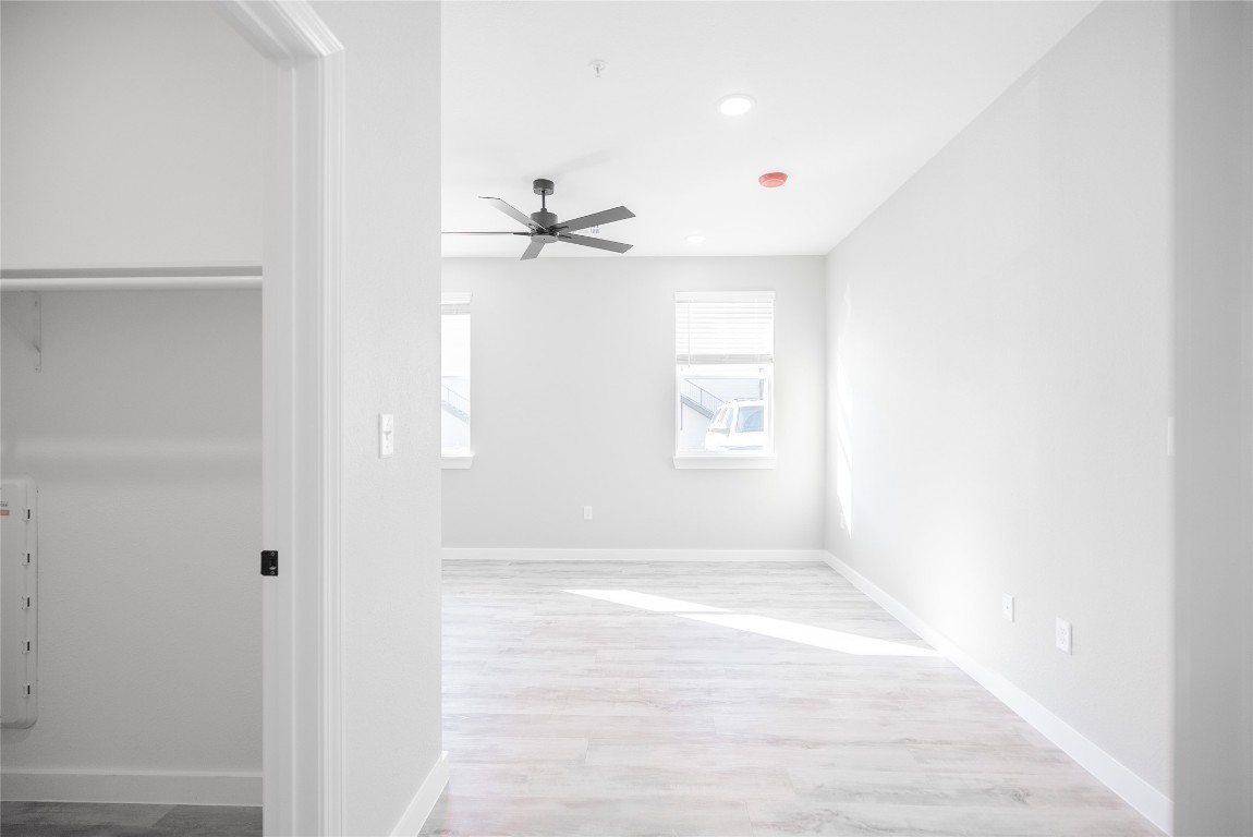 2101 Reinke Road, Unit 8310 Waller, TX 77484 - Photo 18 of 33 a view of a room with a window and wooden floor