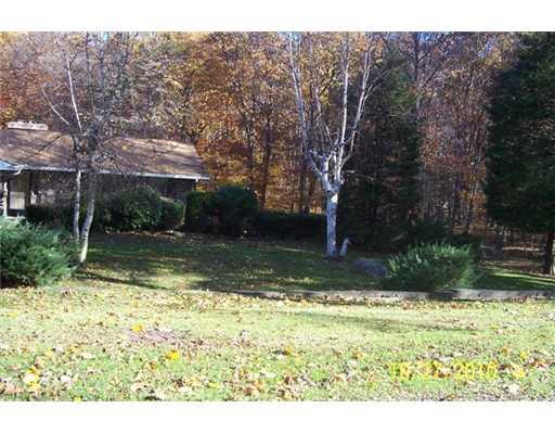 Exterior Front. This private yard has over 3 Acres of land.