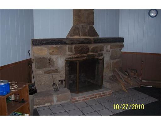 Family Room. Stone fireplace located in finished basement.