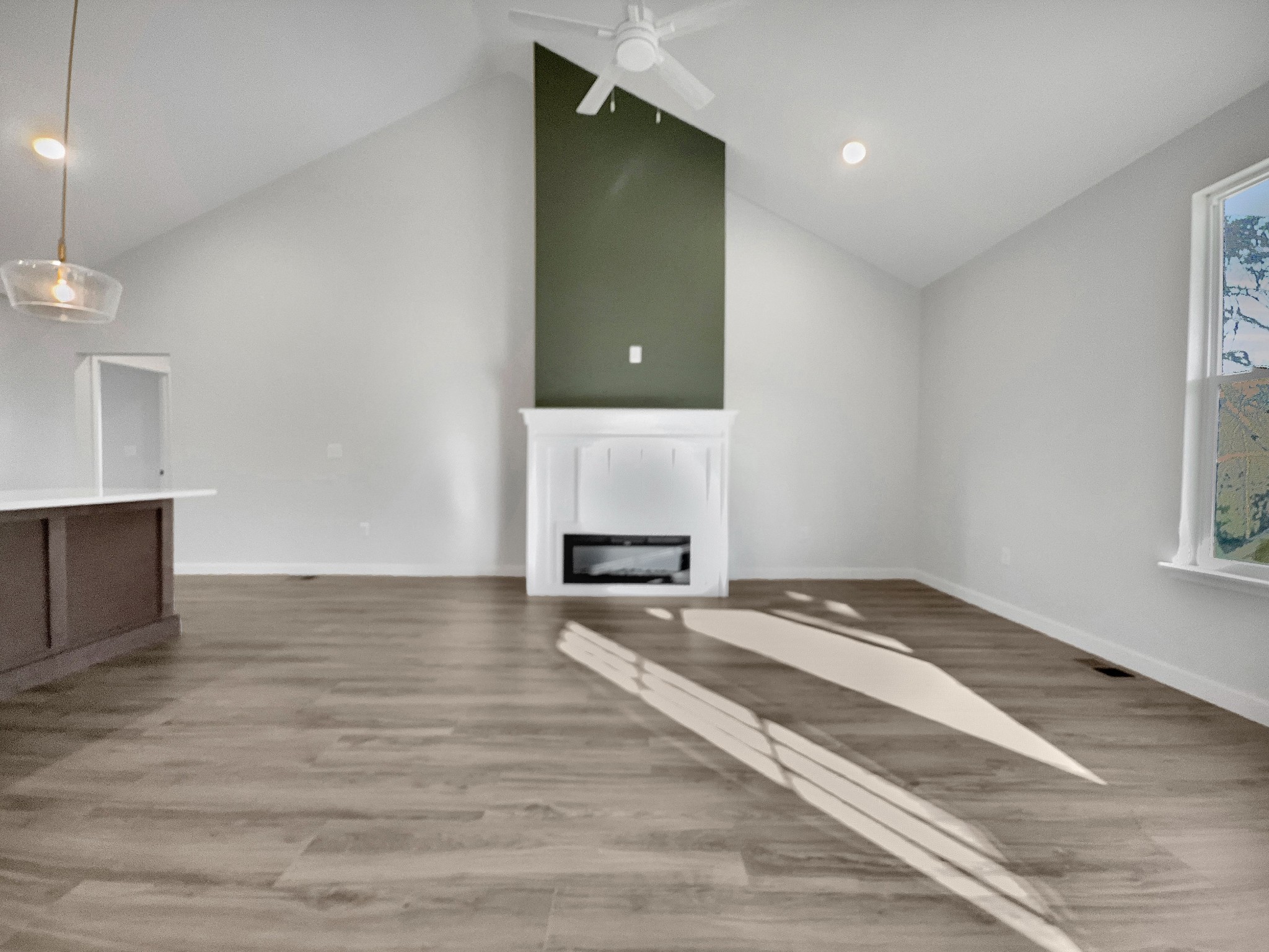 41 Sunny View Drive Carthage, TN 37030 - Photo 15 of 34 a view of an empty room with window and wooden floor