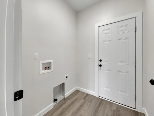a bathroom with a granite countertop toilet and a sink