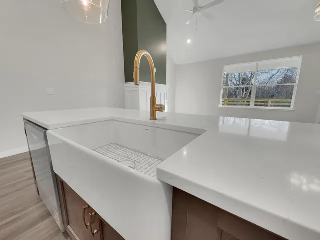 a white bath tub sitting next to a window