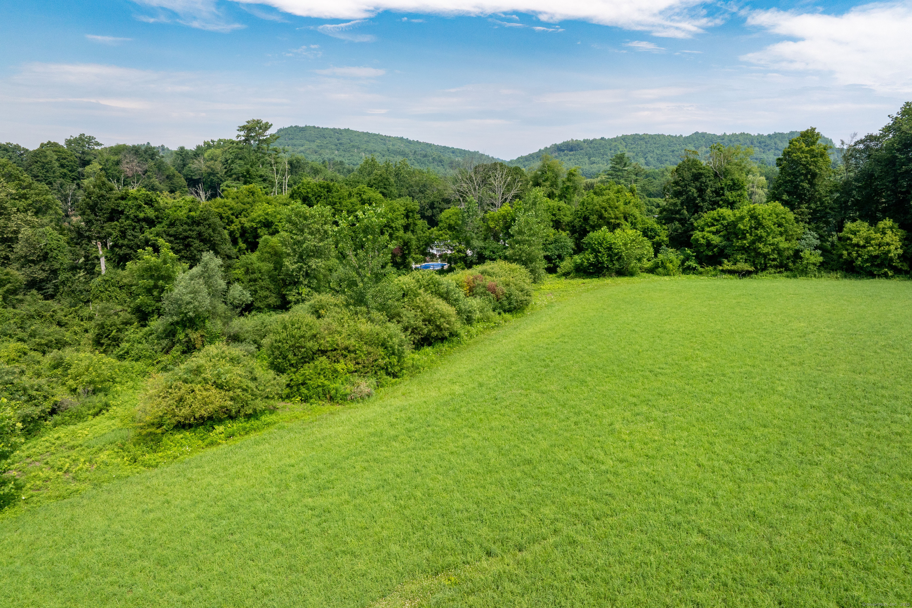 0 Lime Rock Road Lakeville, CT 06039 - Photo 12 of 27 a view of a big yard with lots of green space