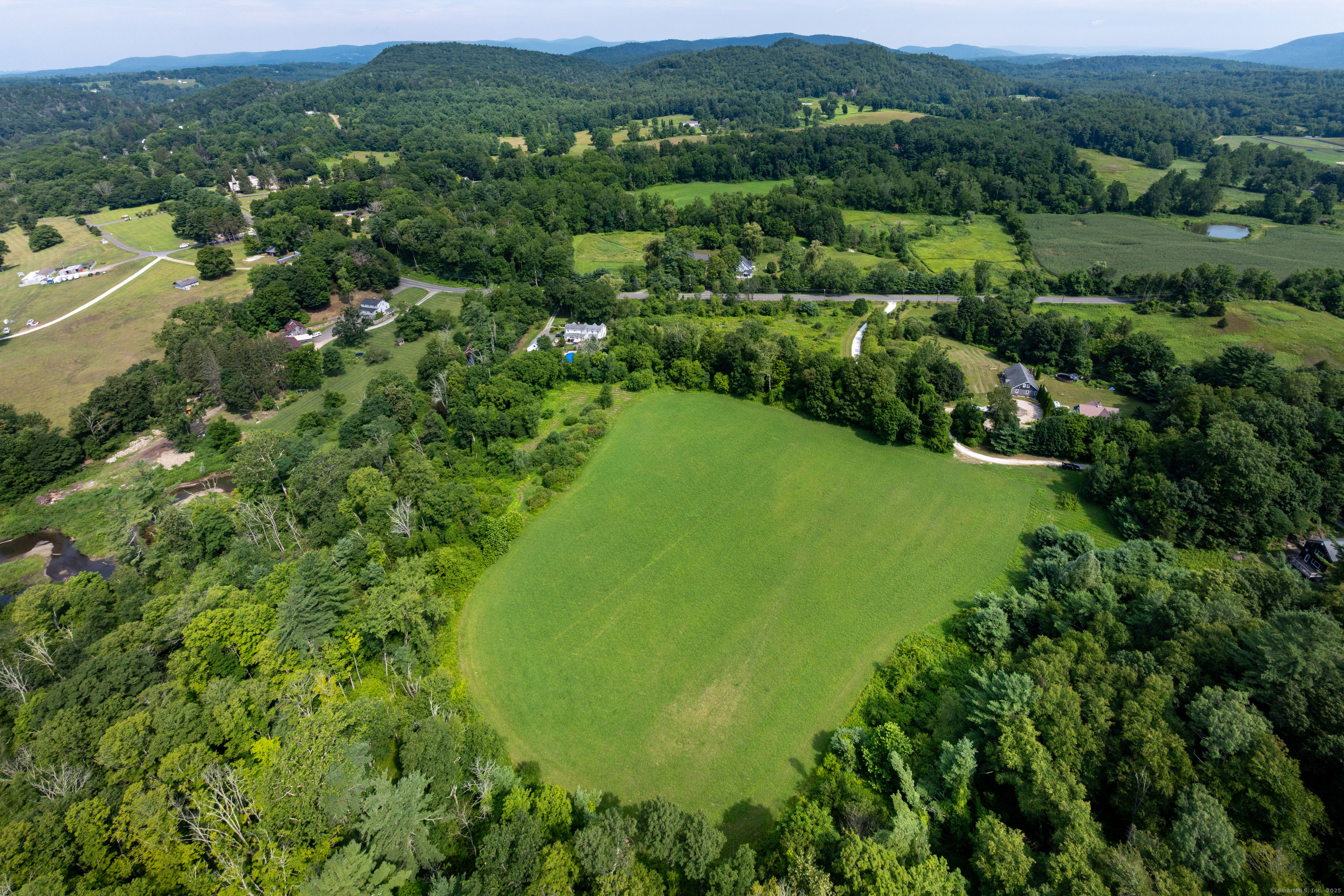 0 Lime Rock Road Lakeville, CT 06039 - Photo 9 of 27 an aerial view of residential houses with outdoor space and trees all around