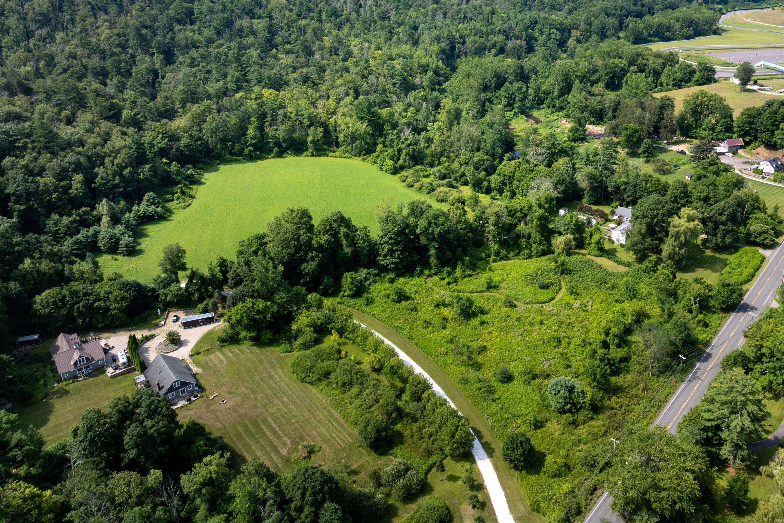 0 Lime Rock Road Lakeville, CT 06039 - Photo 10 of 27 an aerial view of residential house with outdoor space and trees all around