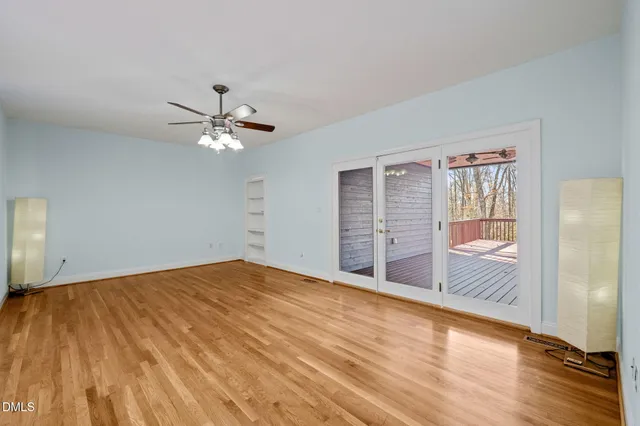 a bathroom with a tub a sink and a window