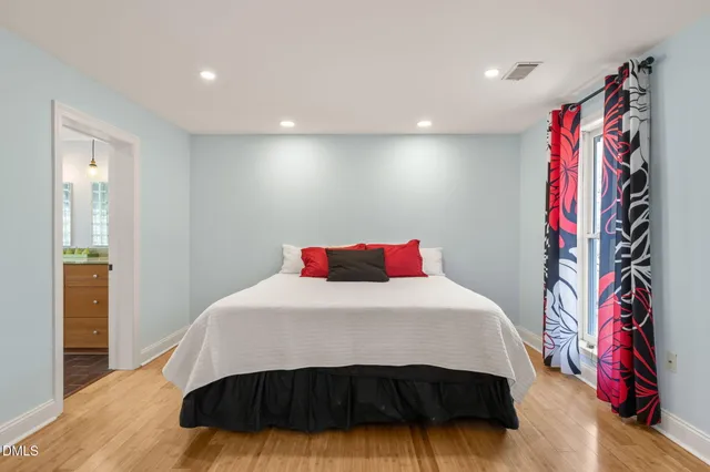 a view of an empty room with a ceiling fan