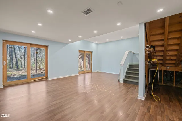 a front view of a house with a big yard