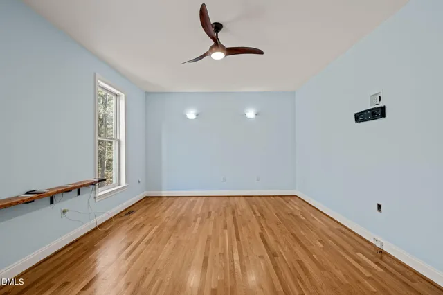 a view of room with window and hardwood floor